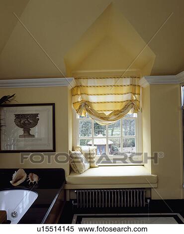 Yellow White Striped Blind Above Dormer Window With Window Seat In