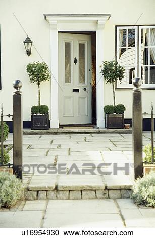 York-stone paving in front of traditional white house with white half-glazed front door View Large Photo Image Stock Image - York-stone paving in front of traditional white house with white half-glazed front door. Fotosearch
