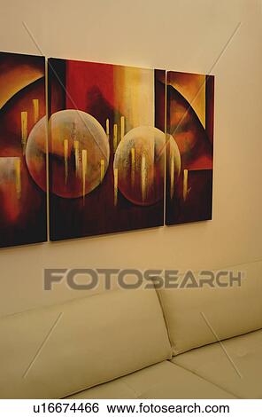 Abstract painting above cream sofa cushions in modern livingroom View Large Photo Image Stock Photograph - Abstract painting above cream sofa cushions in modern livingroom. Fotosearch