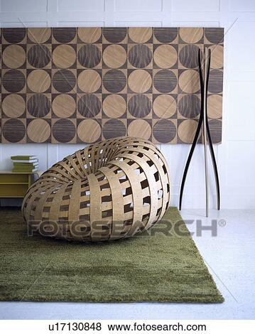 Stock Photo - Abstract picture in modern living room with woven plywood chair. Fotosearch