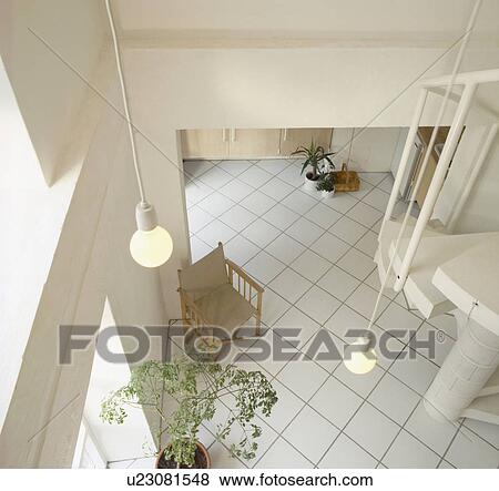 Aerial view of pendant lighting above white tiled floor in modern white hall View Large Photo Image Stock Photo - Aerial view of pendant lighting above white tiled floor in modern white hall. Fotosearch