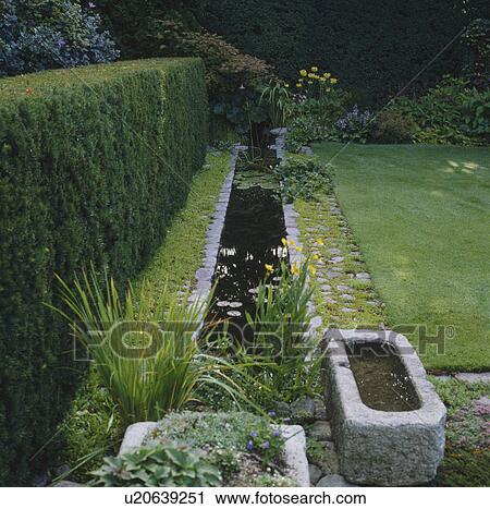 Angular pond in summer garden View Large Photo Image Stock Image - Angular pond in summer garden. Fotosearch