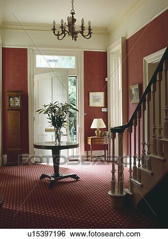 Antique circular table and patterned red carpet in red country hall View Large Photo Image Stock Photograph - Antique circular table and patterned red carpet in red country hall. Fotosearch