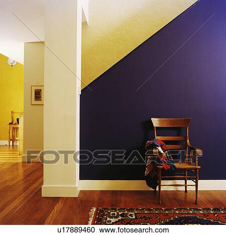 Antique wooden chair in front of purple wall in modern yellow hall with wooden flooring View Large Photo Image Stock Image - Antique wooden chair in front of purple wall in modern yellow hall with wooden flooring. Fotosearch