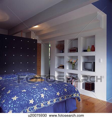 Architectural blue and white double bedroom with shelves as part of structure and screened off bathroom area. View Large Photo Image Stock Image - Architectural blue and white double bedroom with shelves as part of structure and screened off bathroom area.. Fotosearch