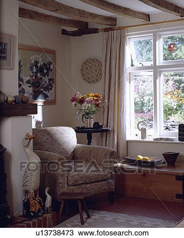 Armchair beside window in cottage living room View Large Photo Image Stock Image - Armchair beside window in cottage living room. Fotosearch