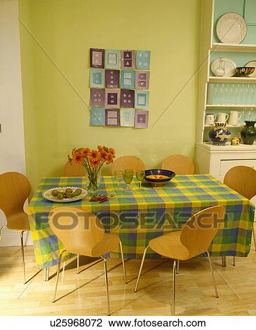 Arne Jacobsen ant chairs in pastel yellow dining room with yellow and green checked cloth on the table View Large Photo Image Stock Image - Arne Jacobsen ant chairs in pastel yellow dining room with yellow and green checked cloth on the table. Fotosearch