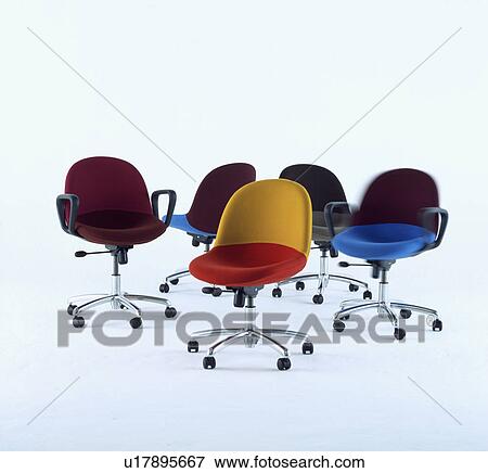 Stock Photo - Assorted coloured contemporary office chairs. &#13; &#10; &#13; &#10; &#13; &#10;. Fotosearch