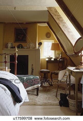 Attic bedroom with sloping walls View Large Photo Image Stock Photo - Attic bedroom with sloping walls. Fotosearch