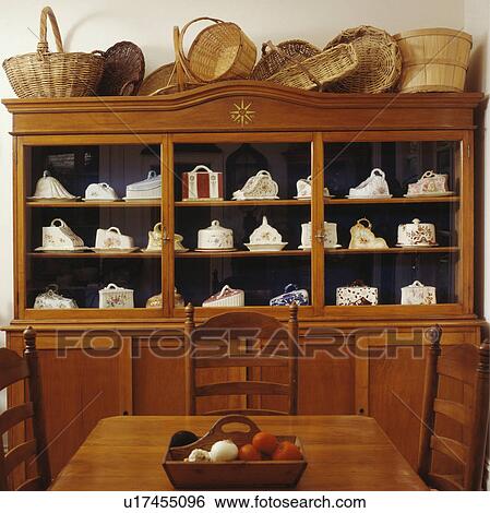 Baskets On Top Of Antique Dresser With Collection Of Antique