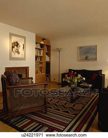 Bergere Armchair And Striped Rug In Living Room Stock Image