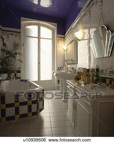 Black+white and yellow tiles on bath in white bathroom with white tiled floor View Large Photo Image Stock Photograph - Black+white and yellow tiles on bath in white bathroom with white tiled floor. Fotosearch