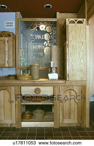 Blender on worktop in wooden kitchen with engraved glass panel View Large Photo Image Stock Image - Blender on worktop in wooden kitchen with engraved glass panel. Fotosearch