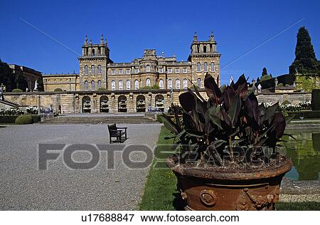 Blenheim Palace, Woodstock, near Oxford, Oxfordshire, England. Water fountains in wall, large plant pot, lower water terrace View Large Photo Image Stock Photo - Blenheim Palace, Woodstock, near Oxford, Oxfordshire, England. Water fountains in wall, large plant pot, lower water terrace. Fotosearch