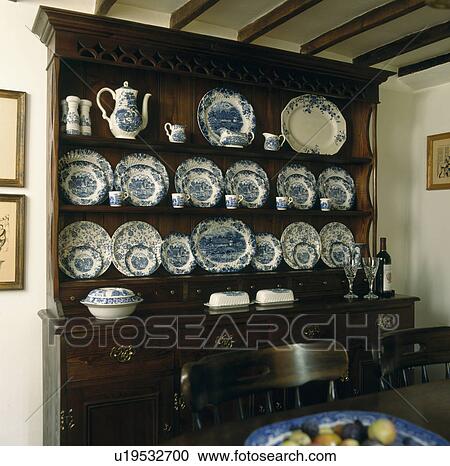 Blue and white china on oak dresser in cottage dining room View Large Photo Image Stock Image - Blue and white china on oak dresser in cottage dining room. Fotosearch