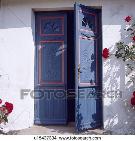 Blue double doors on traditional white country cottage View Large Photo Image Picture - Blue double doors on traditional white country cottage. Fotosearch