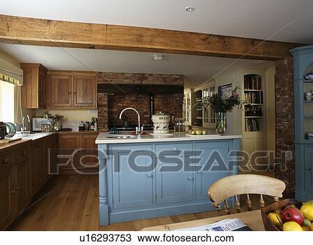 Blue island unit in traditional kitchen diningroom with wooden RSJ View Large Photo Image Stock Image - Blue island unit in traditional kitchen diningroom with wooden RSJ. Fotosearch