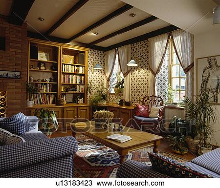 Blue sofas in traditional living room with patterned wallpaper View Large Photo Image Stock Image - Blue sofas in traditional living room with patterned wallpaper. Fotosearch