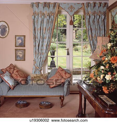 Blue+pink curtains and chaiselongue in pink traditional living room View Large Photo Image Stock Image - Blue+pink curtains and chaiselongue in pink traditional living room. Fotosearch