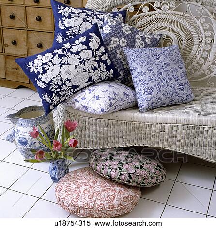 Blue+white floral cushions on sofa in traditional living room View Large Photo Image Stock Photography - Blue+white floral cushions on sofa in traditional living room. Fotosearch