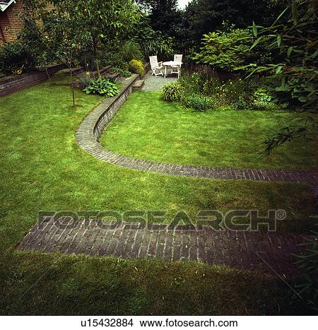 Picture - Brick path and sunken lawn in large country garden. Fotosearch