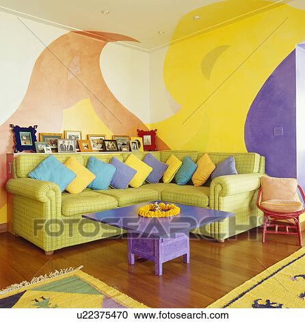 Brightly Coloured Cushions On Lime Green Sofa In Living Room With Colourful Walls An Purple Table Stock Image U22375470 Fotosearch