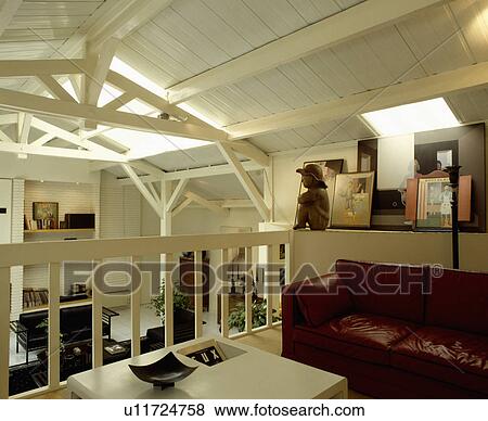 Brown leather sofa on mezzanine in attic conversion View Large Photo Image Stock Photo - Brown leather sofa on mezzanine in attic conversion. Fotosearch