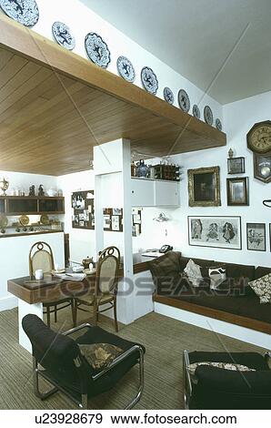 Brown sofa in sixties-style openplan living room View Large Photo Image Stock Photo - Brown sofa in sixties-style openplan living room. Fotosearch