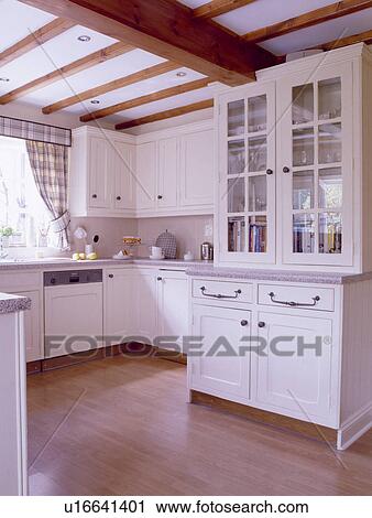 Built In White Dresser In White Country Kitchen With Wooden