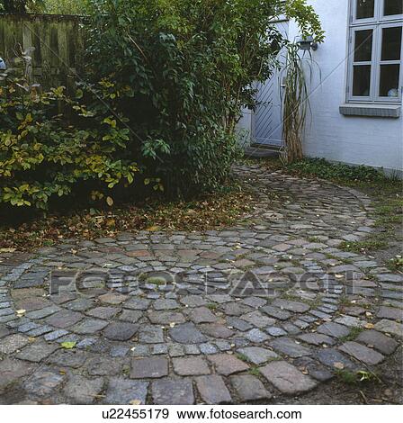 Circular paving in courtyard garden View Large Photo Image Stock Photo - Circular paving in courtyard garden. Fotosearch