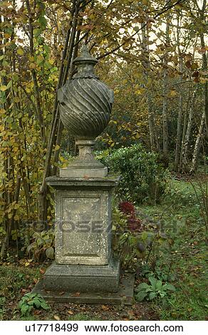 Stock Photo - Classical statue in woodland country garden. Fotosearch