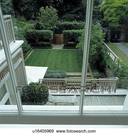 Stock Photo - Clipped box shrubs in formal town garden. Fotosearch