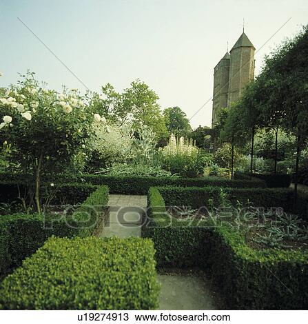Clipped hedges in formal country garden at Sissinghurst in summer View Large Photo Image Stock Image - Clipped hedges in formal country garden at Sissinghurst in summer. Fotosearch