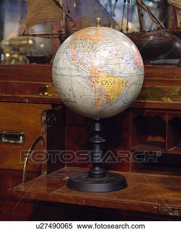 Stock Photography - Close-up of antique globe atlas. Fotosearch