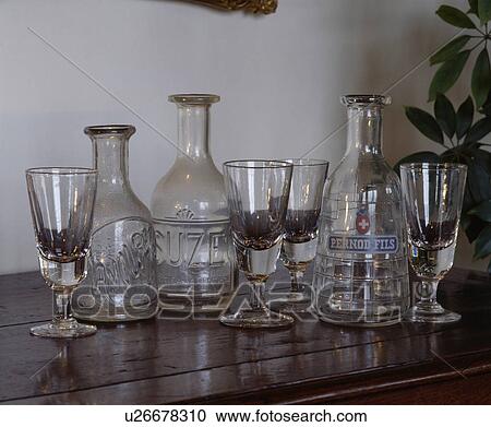 Close-up of antique wineglasses and old French liqueur bottles View Large Photo Image Stock Image - Close-up of antique wineglasses and old French liqueur bottles. Fotosearch