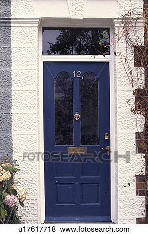 Stock Photo - Close-up of blue door on traditional house. Fotosearch