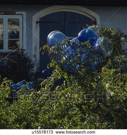 Close-up of blue glass globes in border View Large Photo Image Stock Image - Close-up of blue glass globes in border . Fotosearch