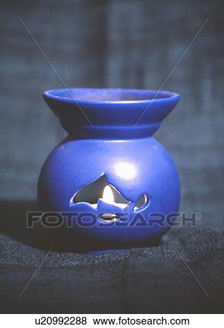 Close up of blue oil burner with candle View Large Photo Image Stock Photo - Close up of blue oil burner with candle. Fotosearch
