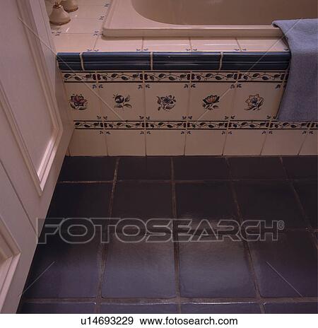 Close-up of blue+white tiled bath surround and terracotta floor tiles View Large Photo Image Stock Photo - Close-up of blue+white tiled bath surround and terracotta floor tiles. Fotosearch