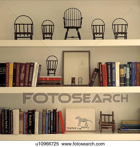 Close-up of books and miniature chairs on shelves View Large Photo Image Stock Photography - Close-up of books and miniature chairs on shelves. Fotosearch