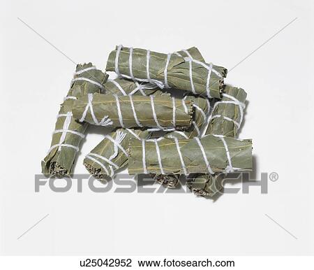 Close-up of bundles of leaf-wrapped dried herbs View Large Photo Image Stock Image - Close-up of bundles of leaf-wrapped dried herbs . Fotosearch