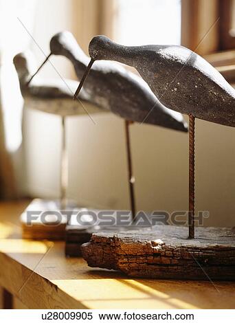 Close-up of carved wooden birds View Large Photo Image Stock Photography - Close-up of carved wooden birds. Fotosearch