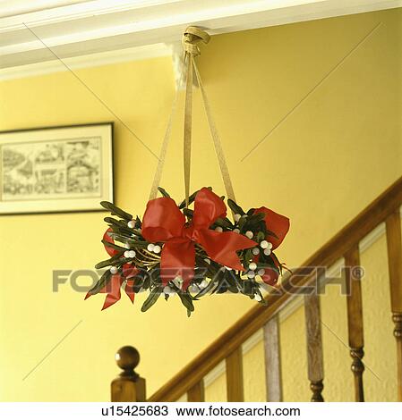 Stock Image - Close-up of Christmas wreath on walla. Fotosearch