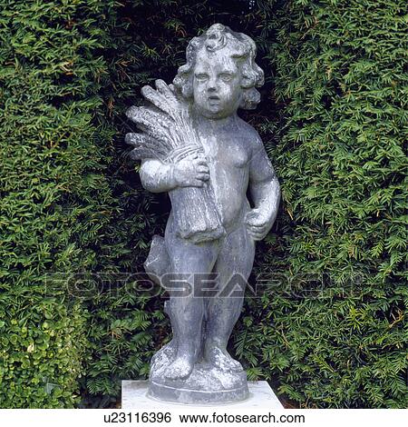 Stock Photograph - Close-up of classical statues in the garden. Fotosearch
