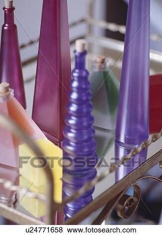 Close-up of colourful glass bottles View Large Photo Image Stock Photo - Close-up of colourful glass bottles. Fotosearch