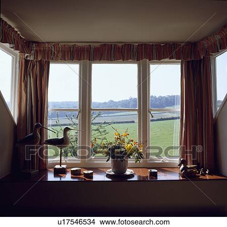 Close-up of cottage window with view of countryside View Large Photo Image Picture - Close-up of cottage window with view of countryside . Fotosearch