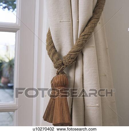 Close-up of cream curtain with rope tieback View Large Photo Image Stock Image - Close-up of cream curtain with rope tieback. Fotosearch