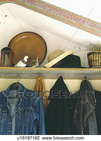 Close-up of denim jackets below painted shelf View Large Photo Image Stock Image - Close-up of denim jackets below painted shelf. Fotosearch