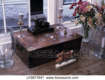 Stock Image - Close-up of Desktop with Ornaments and Chinaware. Fotosearch