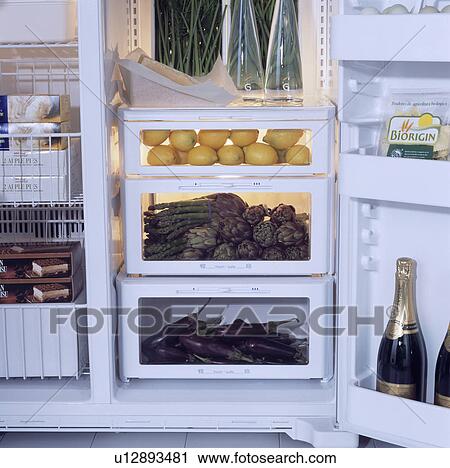 Close-up of doors open on refrigerator with vegetables stored in clear boxes View Large Photo Image Stock Image - Close-up of doors open on refrigerator with vegetables stored in clear boxes . Fotosearch